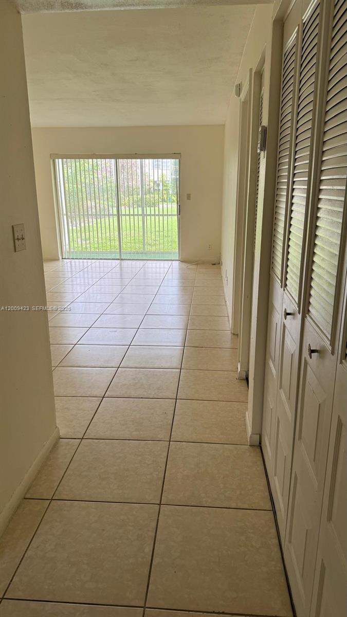 3774 Inverrary Boulevard, Unit 105P Lauderhill, FL 33319 - Photo 4 of 13 a bathroom with a bathtub and a shower