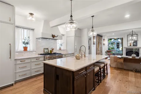 a spacious bathroom with a granite countertop sink and a large mirror