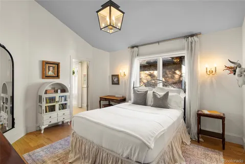 a spacious bedroom with a bed and a couch