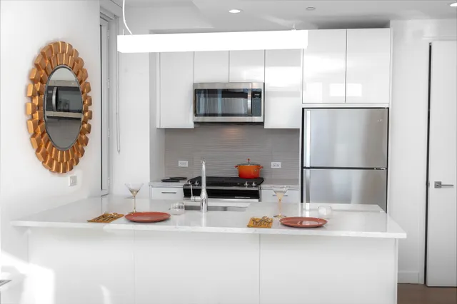 a kitchen with a sink and a refrigerator