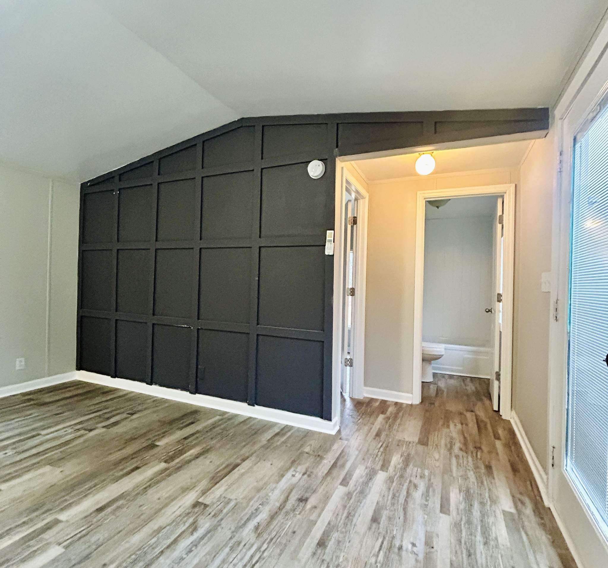 789 Riddle Lane Estill Springs, TN 37330 - Photo 3 of 11 a view of a big room with wooden floor and sliding door