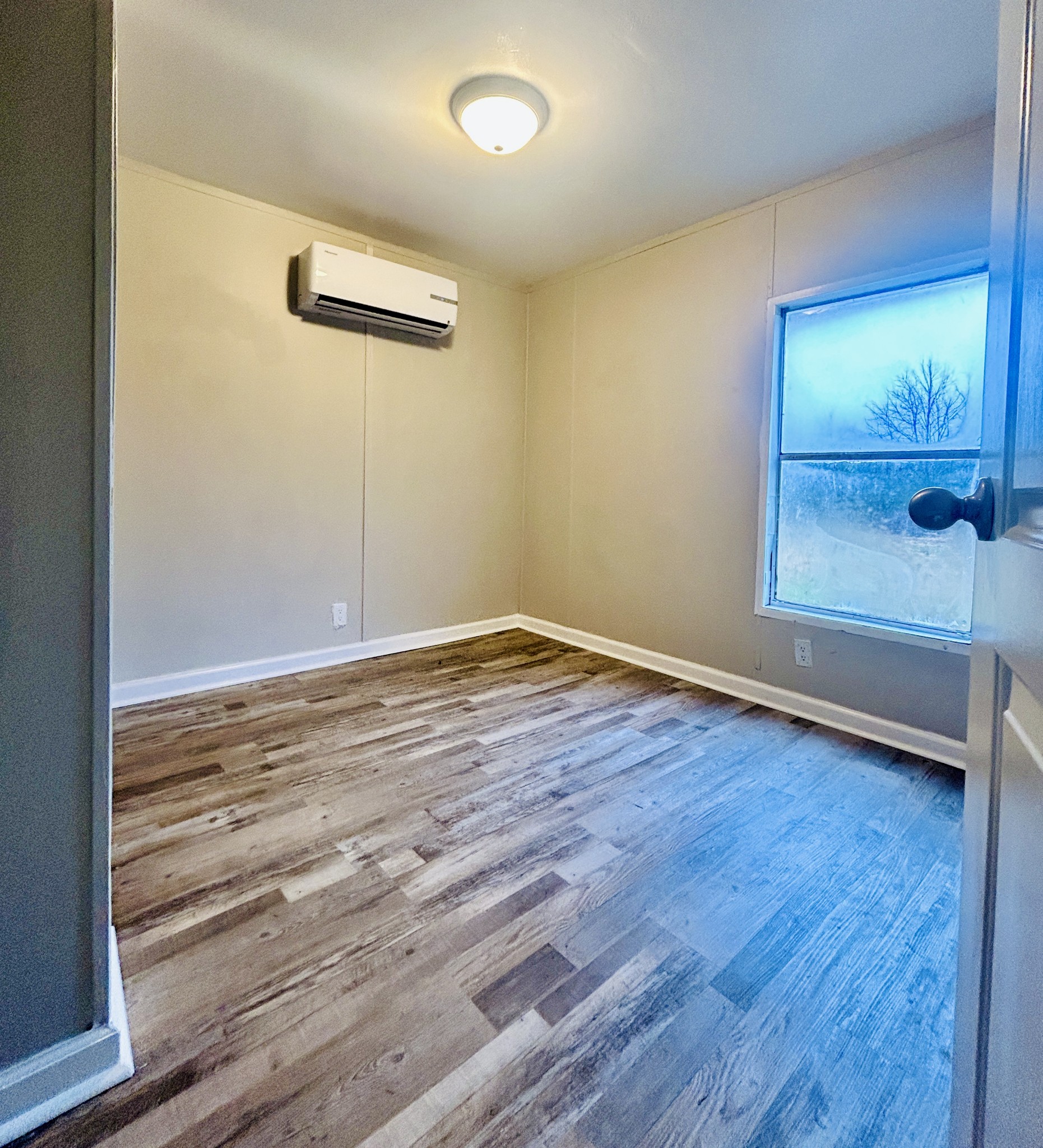 789 Riddle Lane Estill Springs, TN 37330 - Photo 8 of 11 a view of empty room with wooden floor