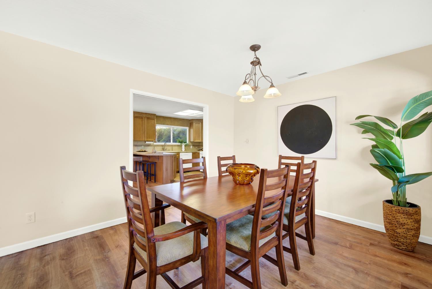 19858 Road 94C Woodland, CA 95695 - Photo 12 of 85 a view of a dining room with furniture and wooden floor