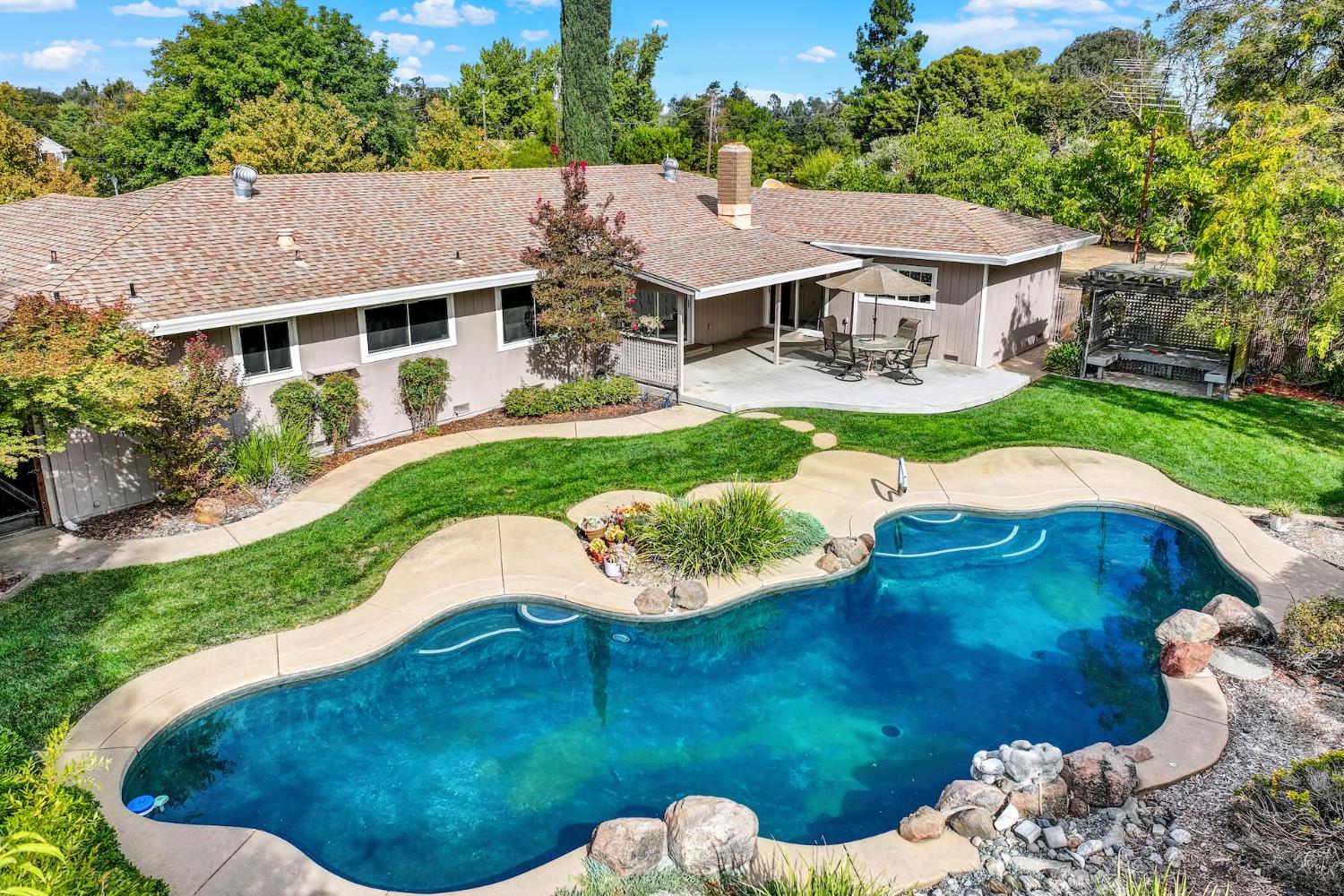19858 Road 94C Woodland, CA 95695 - Photo 17 of 85 a aerial view of a house with a yard table and chairs