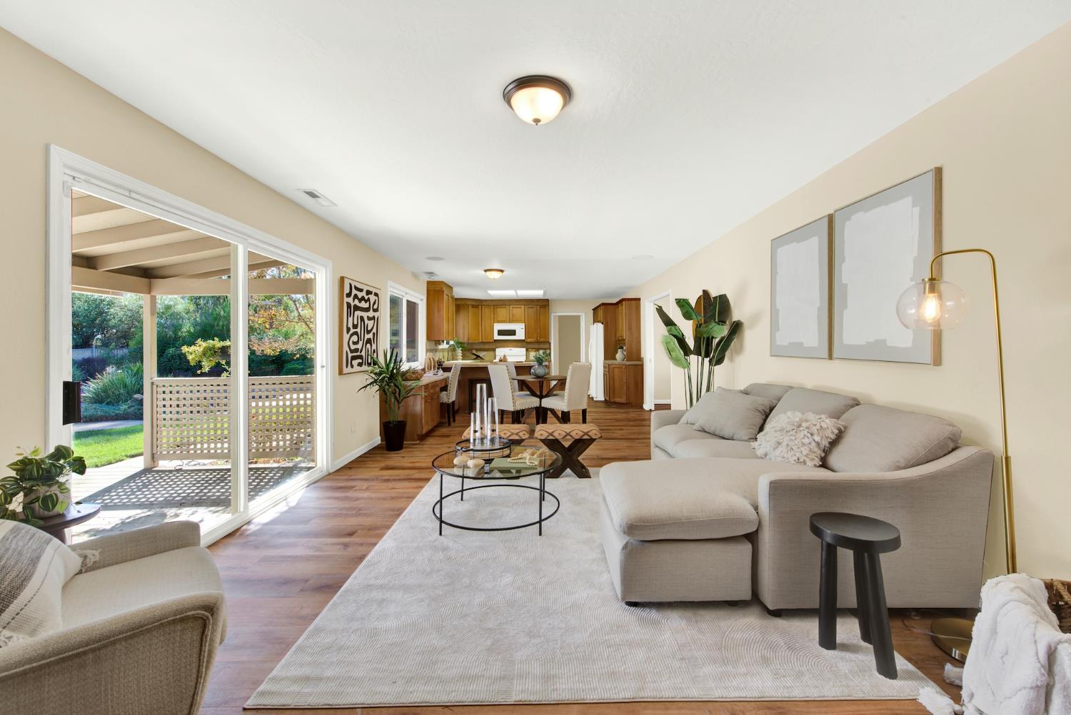 19858 Road 94C Woodland, CA 95695 - Photo 23 of 85 a living room with furniture large window and flat screen tv