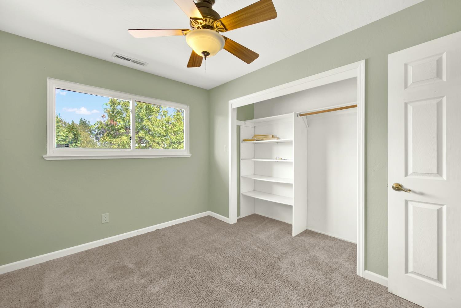 19858 Road 94C Woodland, CA 95695 - Photo 57 of 85 a view of empty room with window and ceiling fan