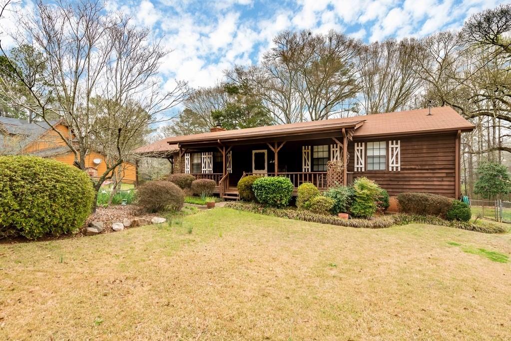 4891 Lewis Road Powder Springs, GA 30127 - Photo 1 of 1 a view of a house with a yard
