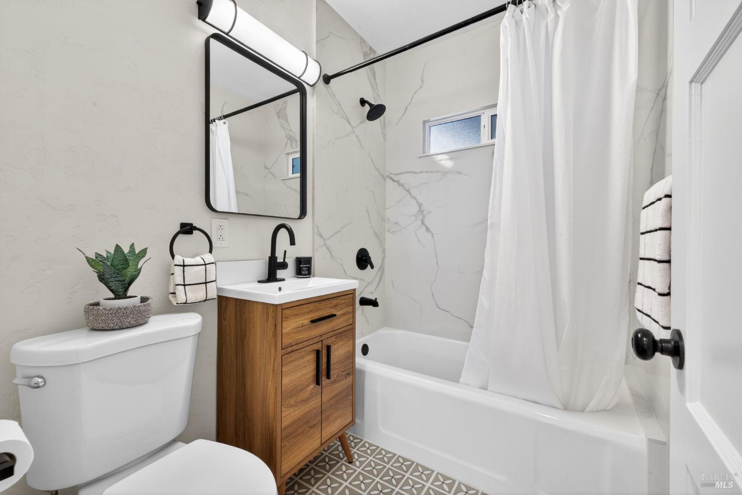 2211 Humboldt Street Santa Rosa, CA 95404 - Photo 21 of 52 a bathroom with a sink toilet and shower