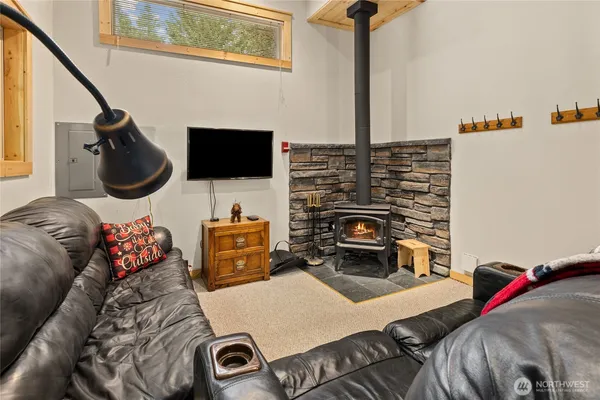 a bedroom with furniture and a fireplace