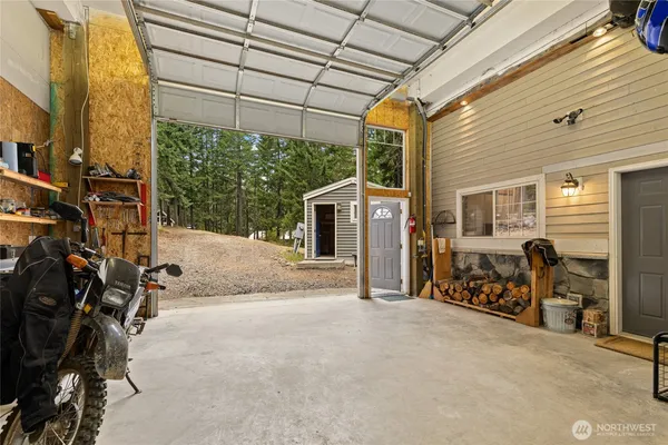 a view of a storage room with furniture and a window