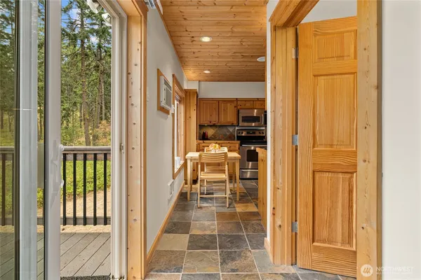 a view of a walk in closet and balcony