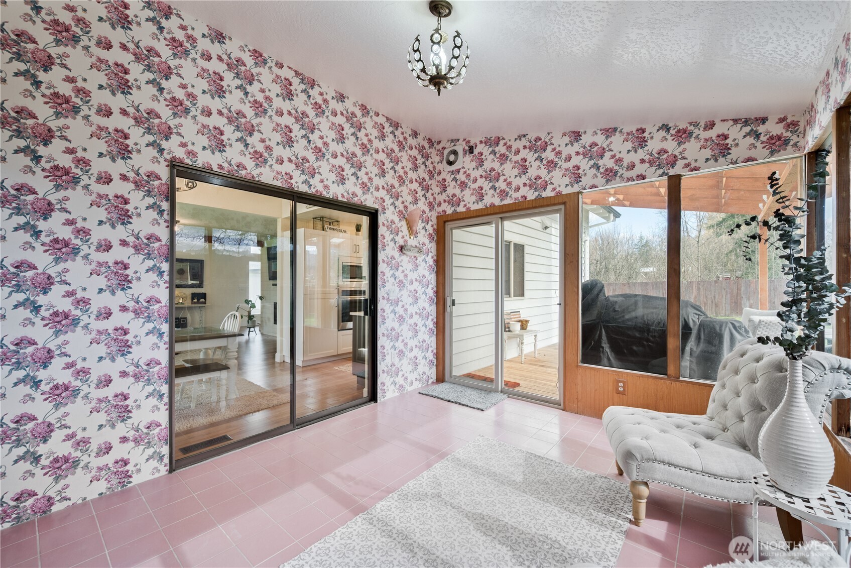 1239 Rose Valley Road Kelso, WA 98626 - Photo 14 of 40 a spacious bedroom with a large bed and a chandelier