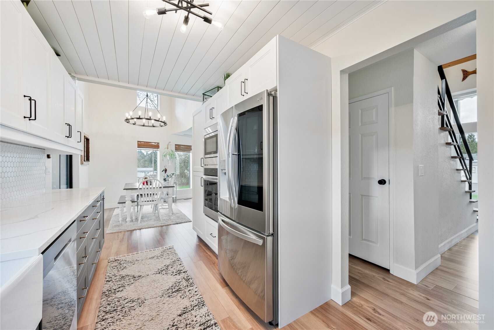 1239 Rose Valley Road Kelso, WA 98626 - Photo 18 of 40 a kitchen with granite countertop a refrigerator and a sink