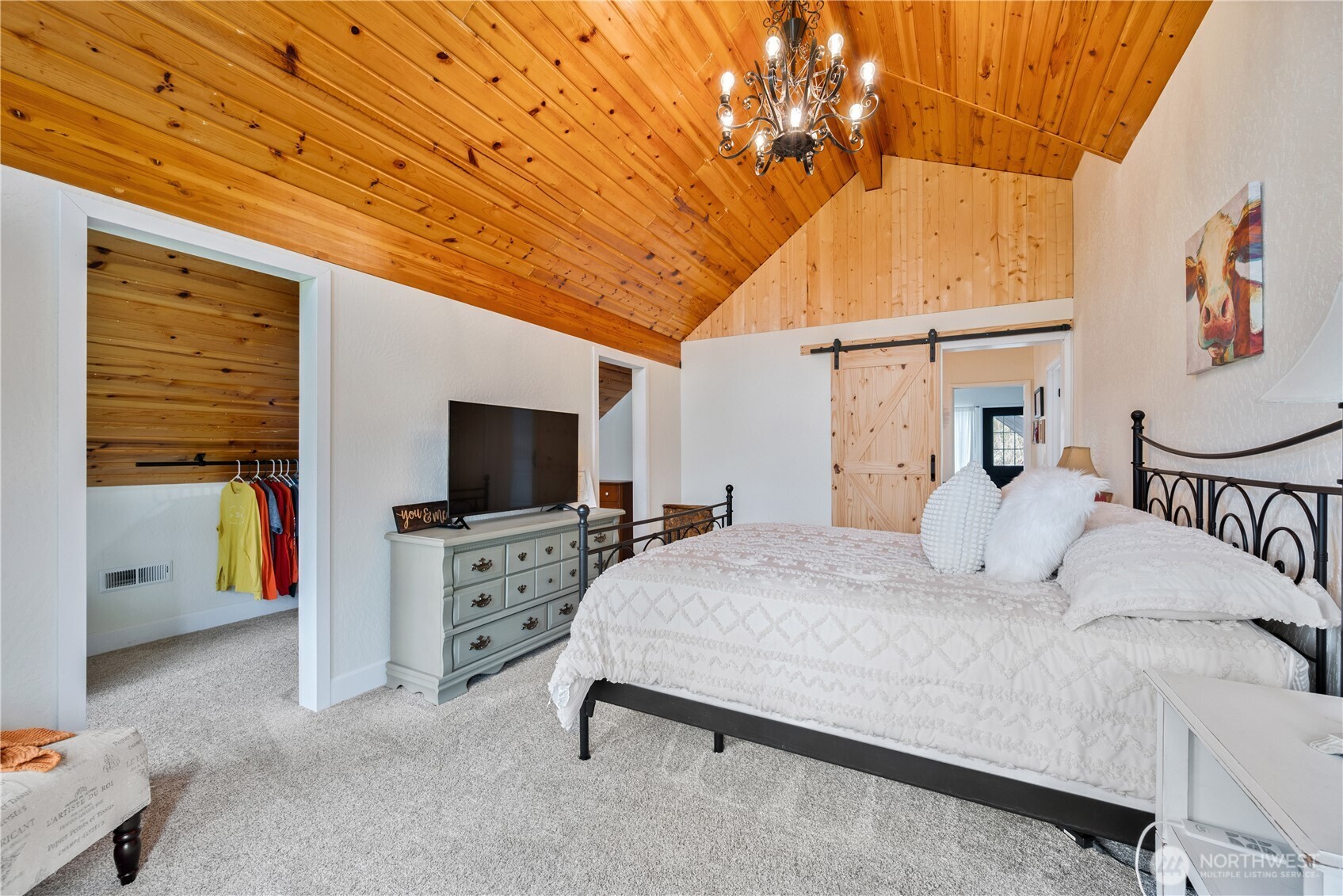 1239 Rose Valley Road Kelso, WA 98626 - Photo 22 of 40 a bedroom with a bed and a flat tv screen on wall