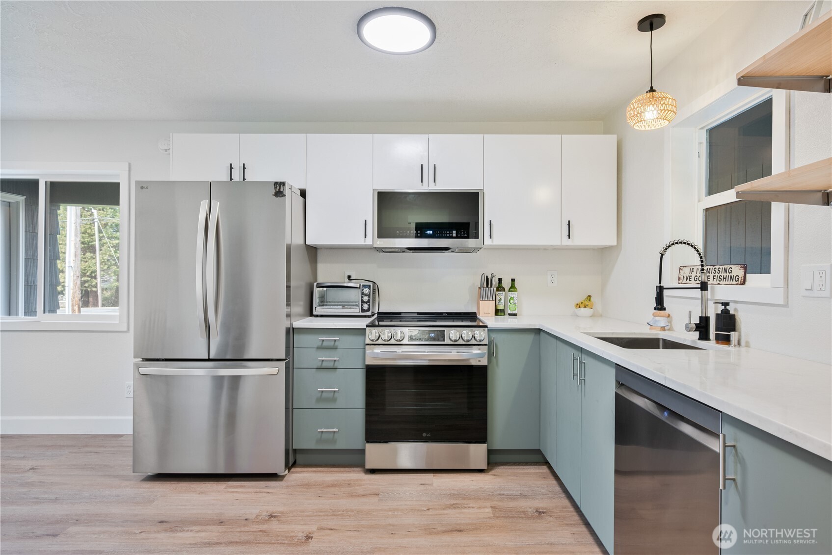1239 Rose Valley Road Kelso, WA 98626 - Photo 38 of 40 a kitchen with stainless steel appliances granite countertop a refrigerator a stove a sink and a microwave