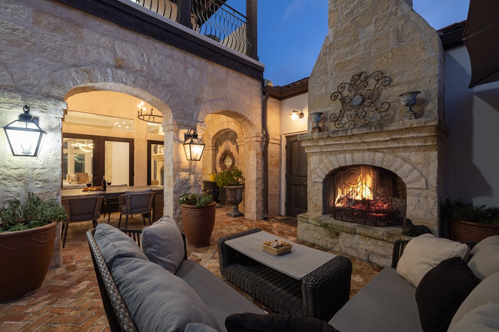 2975 Bear Creek Road Fredericksburg, TX 78624 - Photo 23 of 53 a living room with furniture fireplace and a fireplace