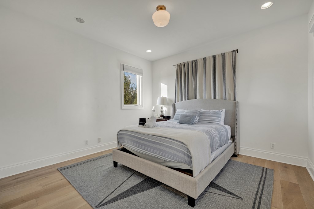 2975 Bear Creek Road Fredericksburg, TX 78624 - Photo 26 of 53 a bed room with a bed and a window