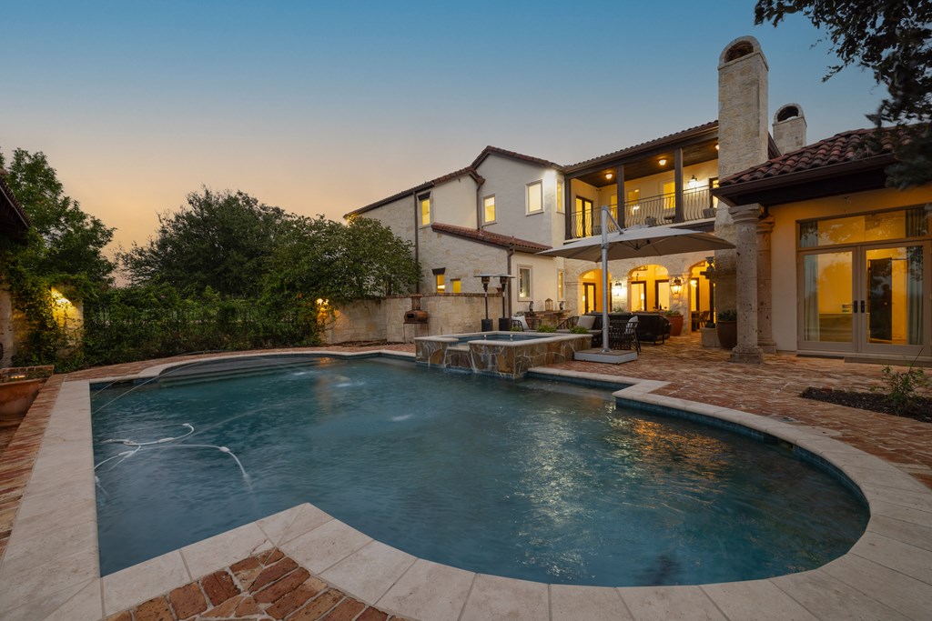 2975 Bear Creek Road Fredericksburg, TX 78624 - Photo 32 of 53 a view of a house with swimming pool