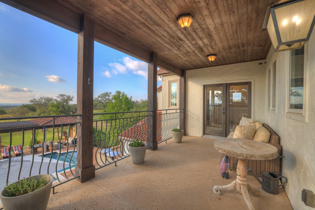 2975 Bear Creek Road Fredericksburg, TX 78624 - Photo 33 of 53 a living room with furniture and a floor to ceiling window