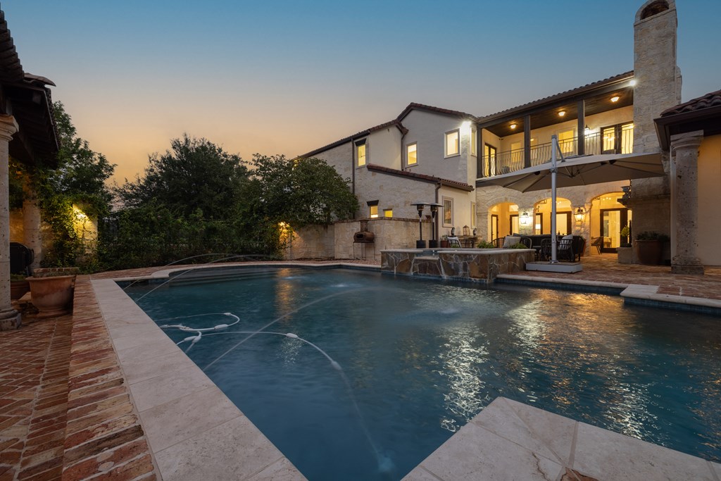2975 Bear Creek Road Fredericksburg, TX 78624 - Photo 41 of 53 a view of a swimming pool with a patio