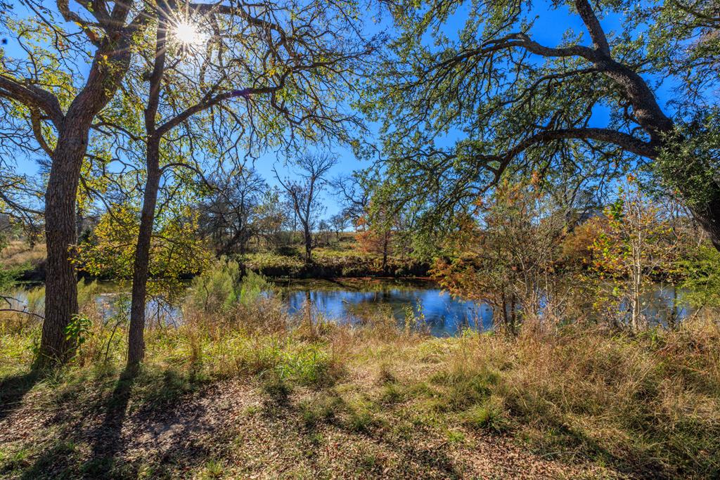 2975 Bear Creek Road Fredericksburg, TX 78624 - Photo 47 of 53 a view of lake with houses