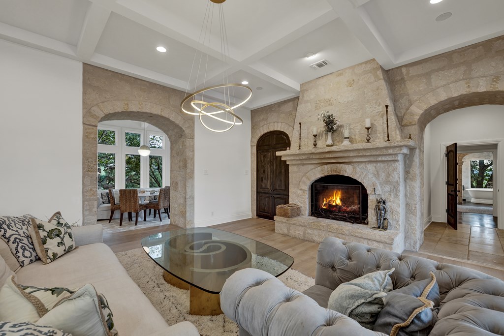 2975 Bear Creek Road Fredericksburg, TX 78624 - Photo 8 of 53 a living room with furniture and a fireplace