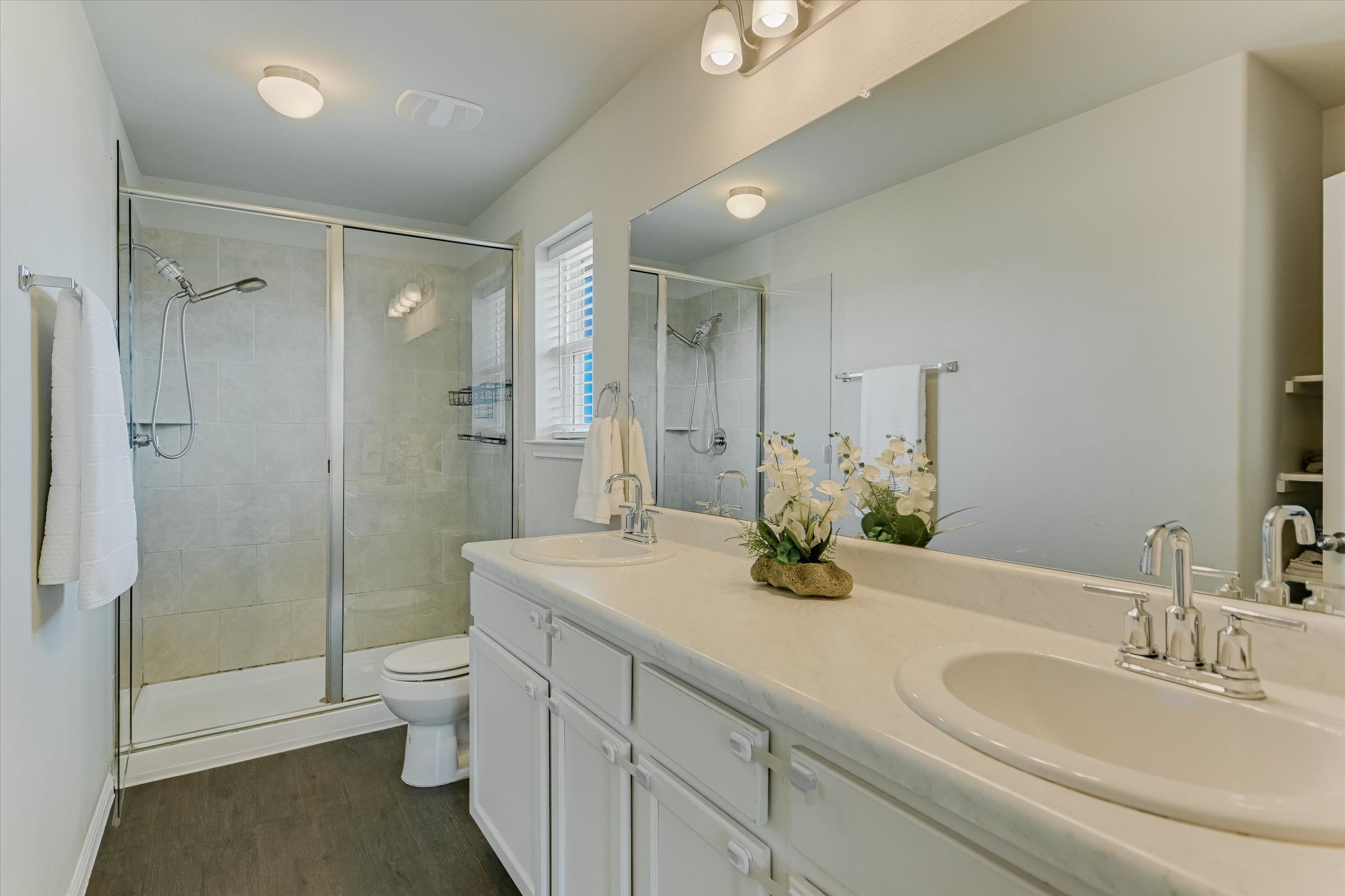 6304 Gunflint Drive Austin, TX 78747 - Photo 12 of 28 Double sinks, a walk-in shower, and enough space to share without compromise.