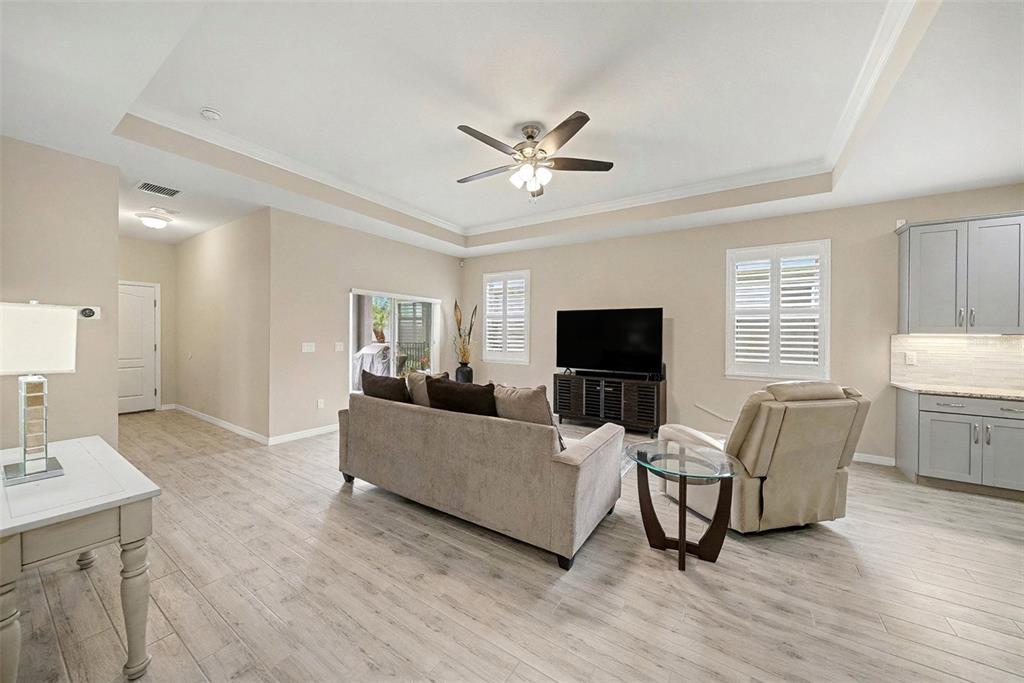 14902 Caravan Avenue Odessa, FL 33556 - Photo 11 of 40 a living room with furniture and a flat screen tv