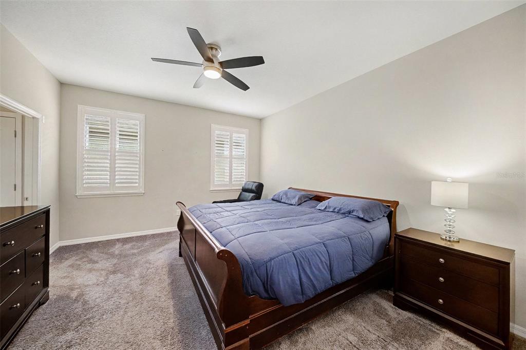 14902 Caravan Avenue Odessa, FL 33556 - Photo 20 of 40 a bedroom with a bed and a dresser