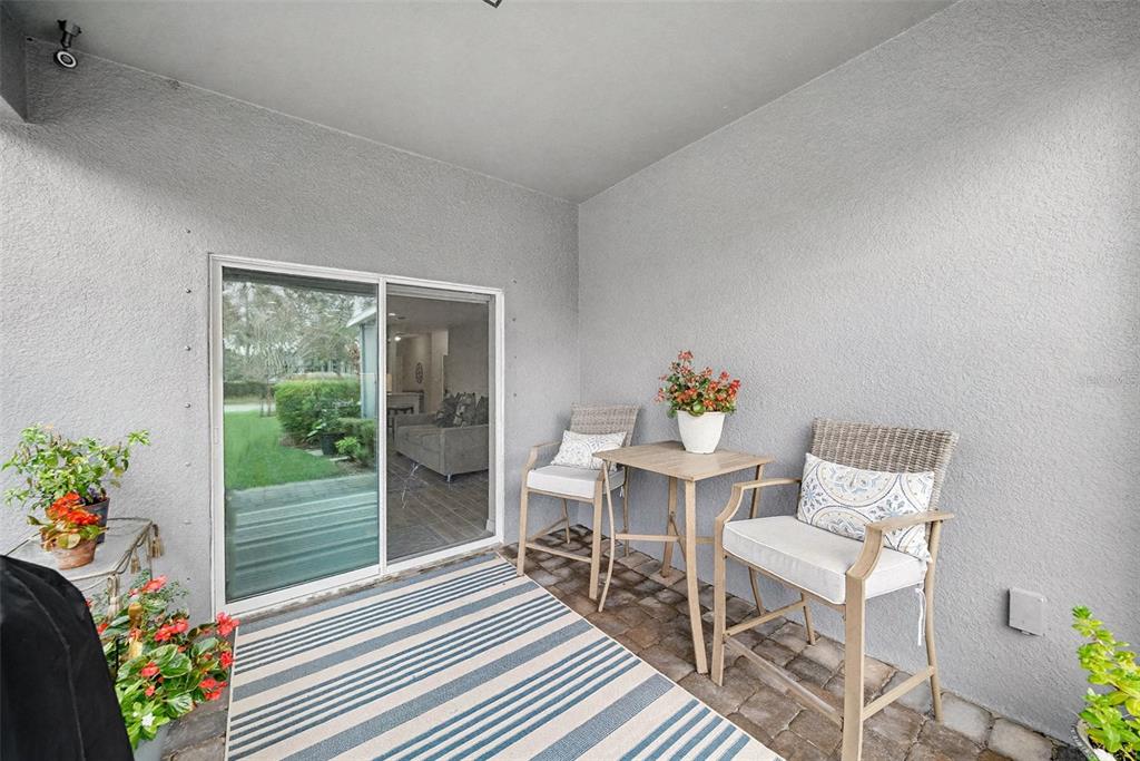 14902 Caravan Avenue Odessa, FL 33556 - Photo 25 of 40 a dining room with furniture and a potted plants