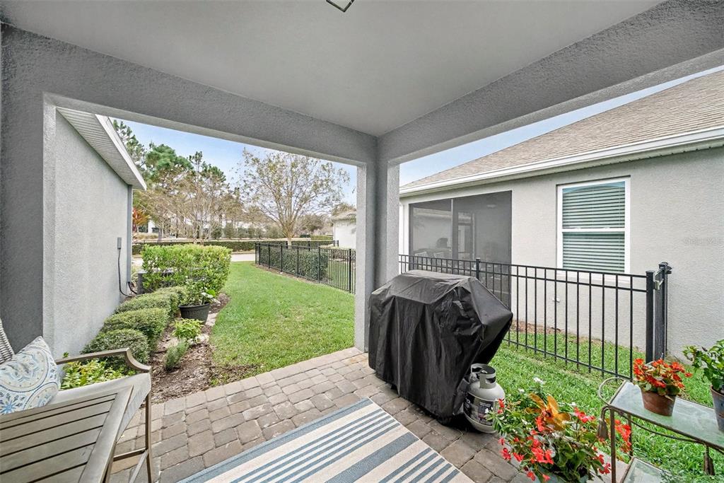 14902 Caravan Avenue Odessa, FL 33556 - Photo 26 of 40 a view of a porch with furniture and garden
