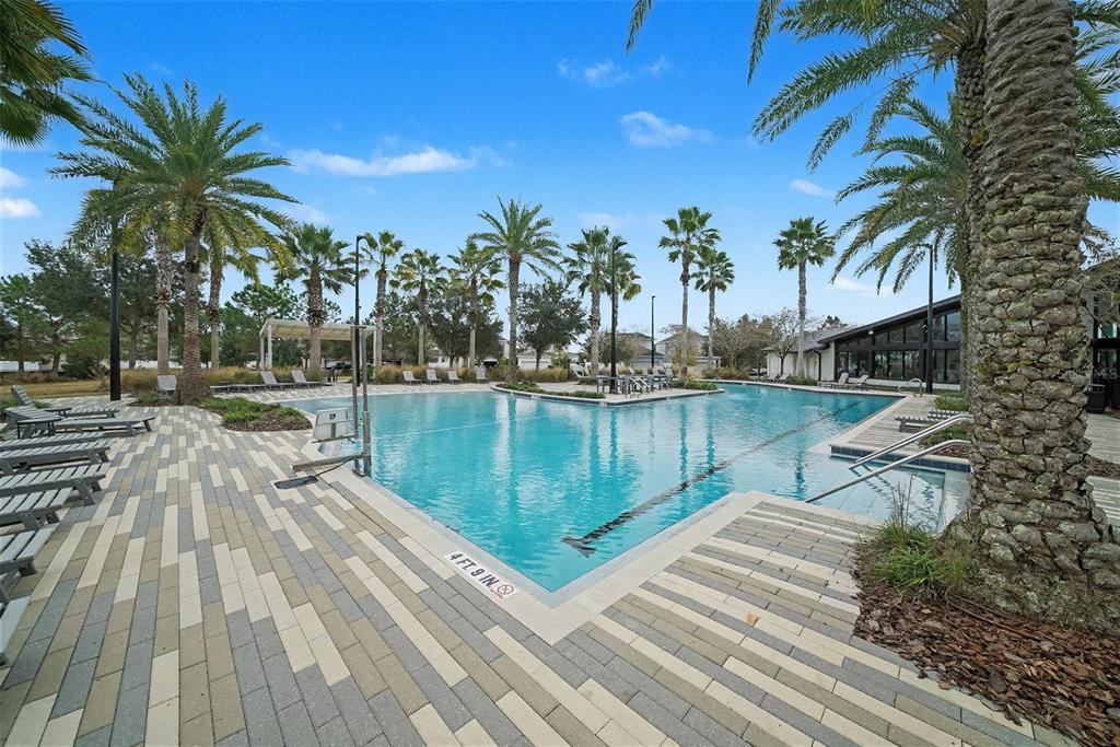 14902 Caravan Avenue Odessa, FL 33556 - Photo 34 of 40 a view of a lake with a house