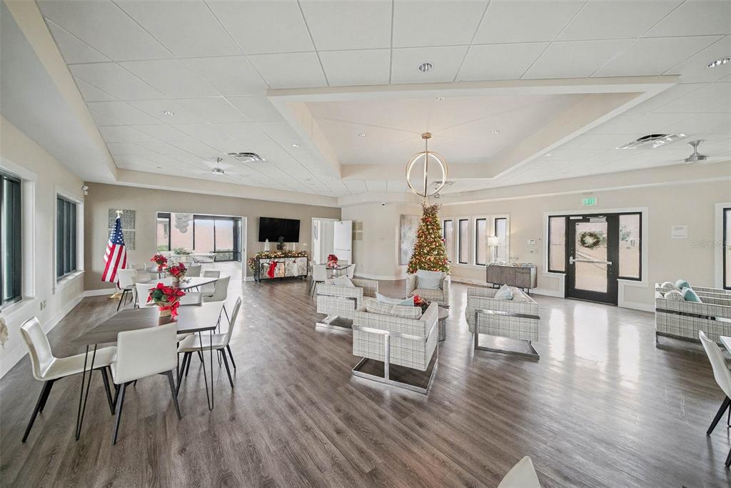 14902 Caravan Avenue Odessa, FL 33556 - Photo 36 of 40 a living room with furniture and a wooden floor