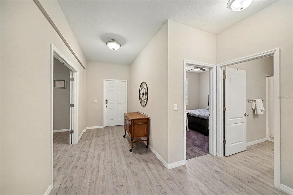 14902 Caravan Avenue Odessa, FL 33556 - Photo 6 of 40 a view of kitchen with refrigerator and wooden floor