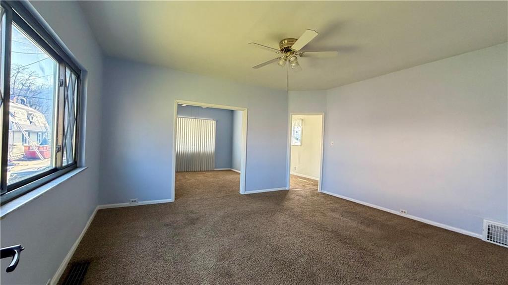 641 Garfield Street Springdale, PA 15144 - Photo 11 of 44 an empty room that has a window