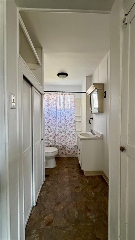 641 Garfield Street Springdale, PA 15144 - Photo 17 of 44 a bathroom with a sink a toilet and shower