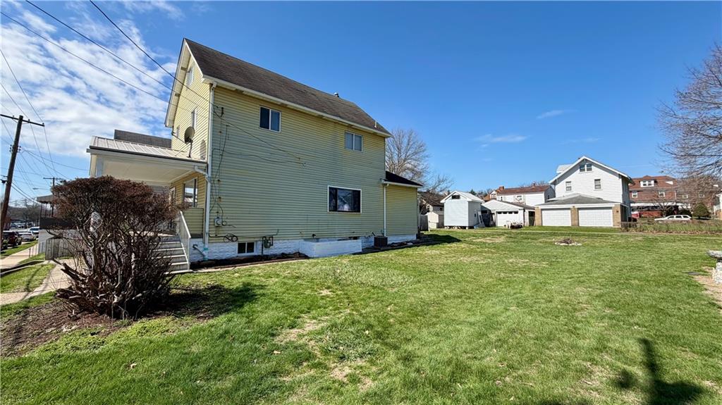 641 Garfield Street Springdale, PA 15144 - Photo 2 of 44 a front view of a house with garden