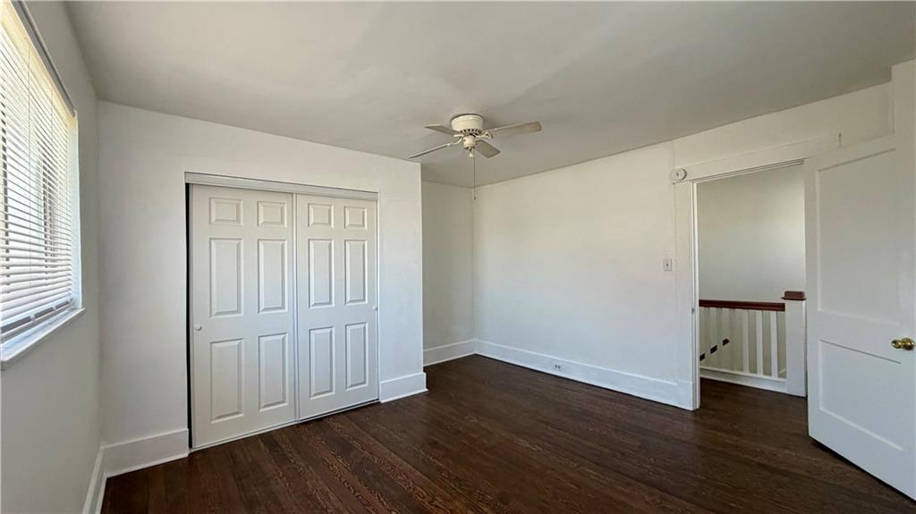 641 Garfield Street Springdale, PA 15144 - Photo 22 of 44 an empty room with wooden floor ceiling fan and windows