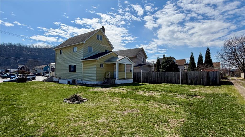 641 Garfield Street Springdale, PA 15144 - Photo 41 of 44 a view of backyard with seating space and wooden fence