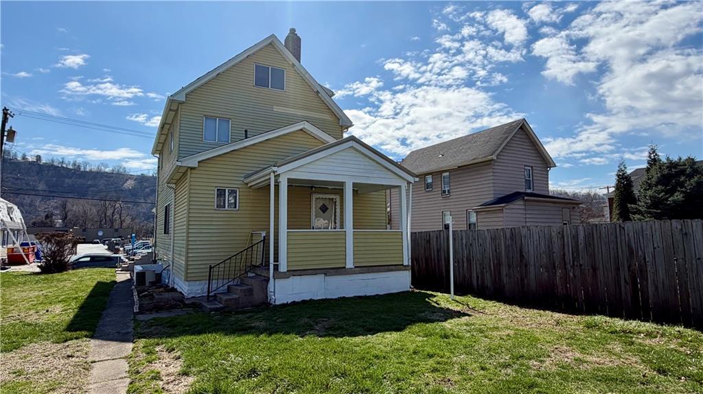 641 Garfield Street Springdale, PA 15144 - Photo 43 of 44 a front view of a house with garden