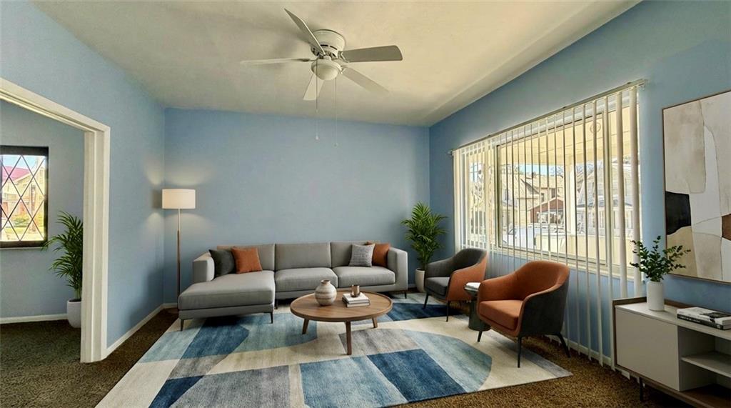 641 Garfield Street Springdale, PA 15144 - Photo 6 of 44 a living room with furniture and a large window