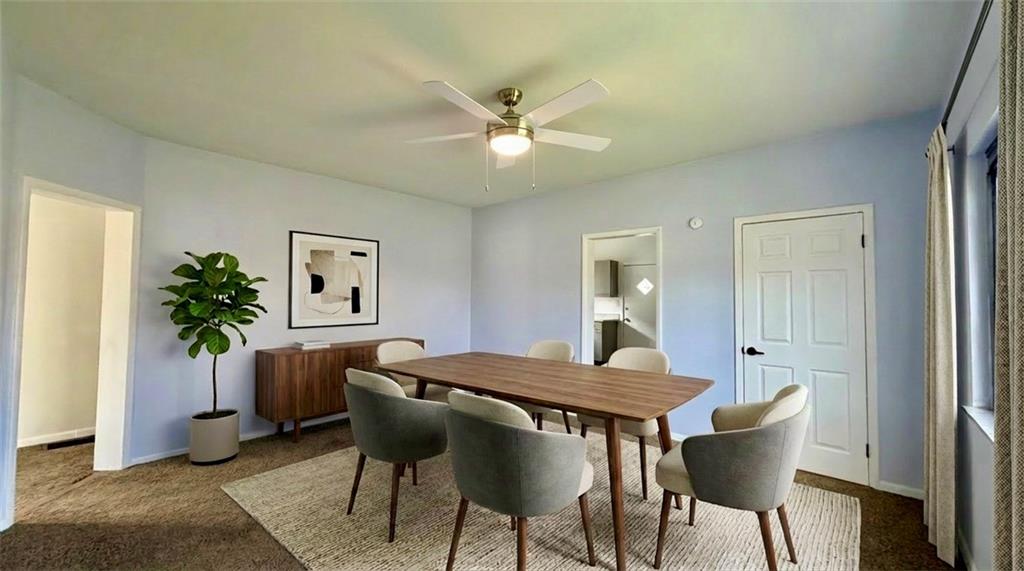 641 Garfield Street Springdale, PA 15144 - Photo 8 of 44 a view of a dining room with furniture and a potted plant