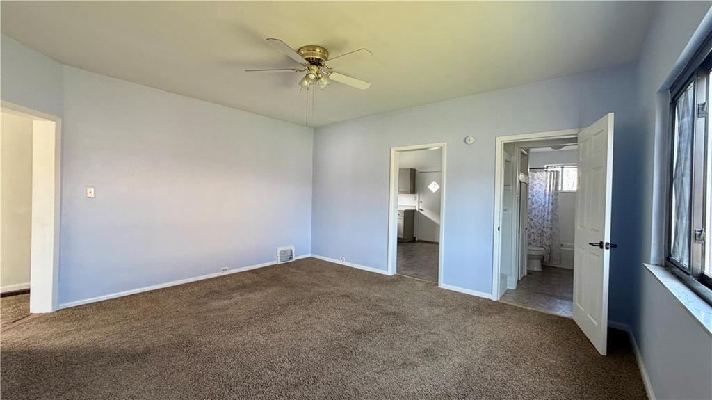 641 Garfield Street Springdale, PA 15144 - Photo 10 of 44 wooden floor in an empty room and a bathroom