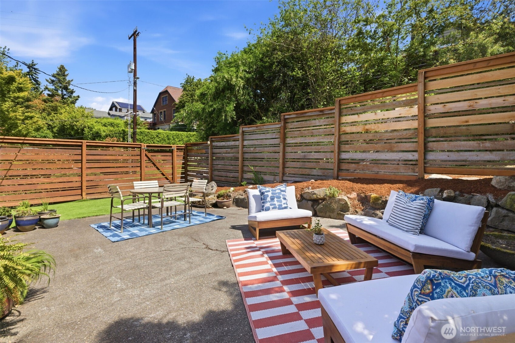 2803 South Walker Street Seattle, WA 98144 - Photo 29 of 40 a view of a patio with couches chairs and a fire pit