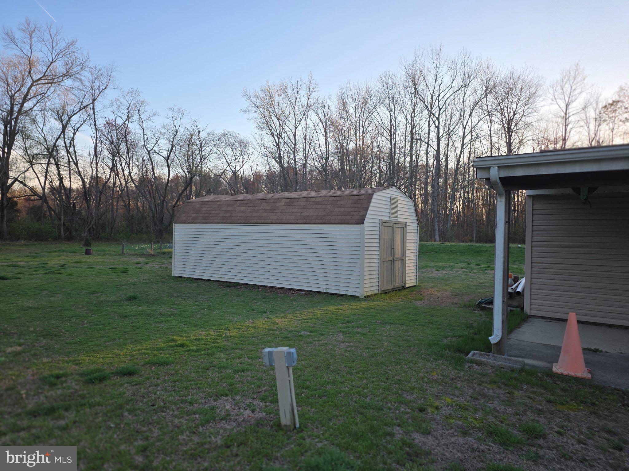 1554 Flora Road Vineland, NJ 08360 - Photo 4 of 4 Charming shed nestled in serene greenery.