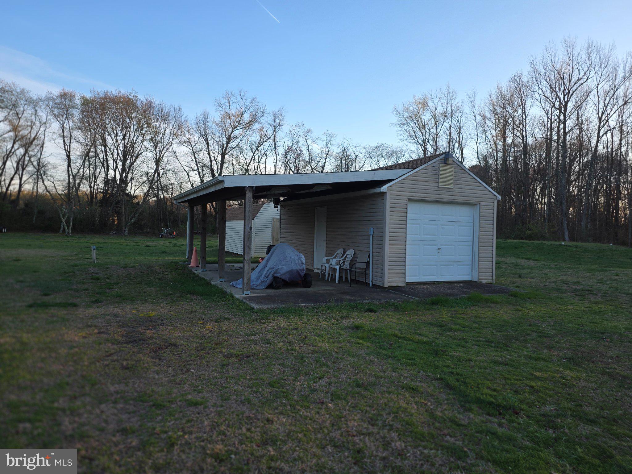 1554 Flora Road Vineland, NJ 08360 - Photo 5 of 5 Charming shed in a serene landscape.
