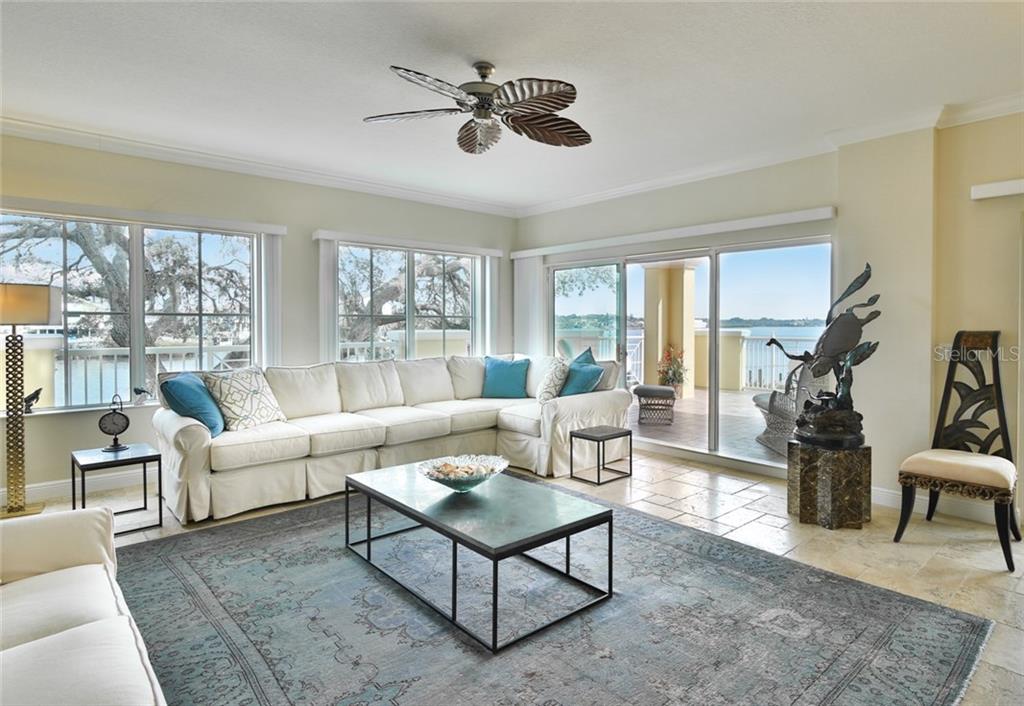 1310 Old Stickney Point Road, Unit E21 Sarasota, FL 34242 - Photo 4 of 25 Amazing bay views-living room and large open air terrace