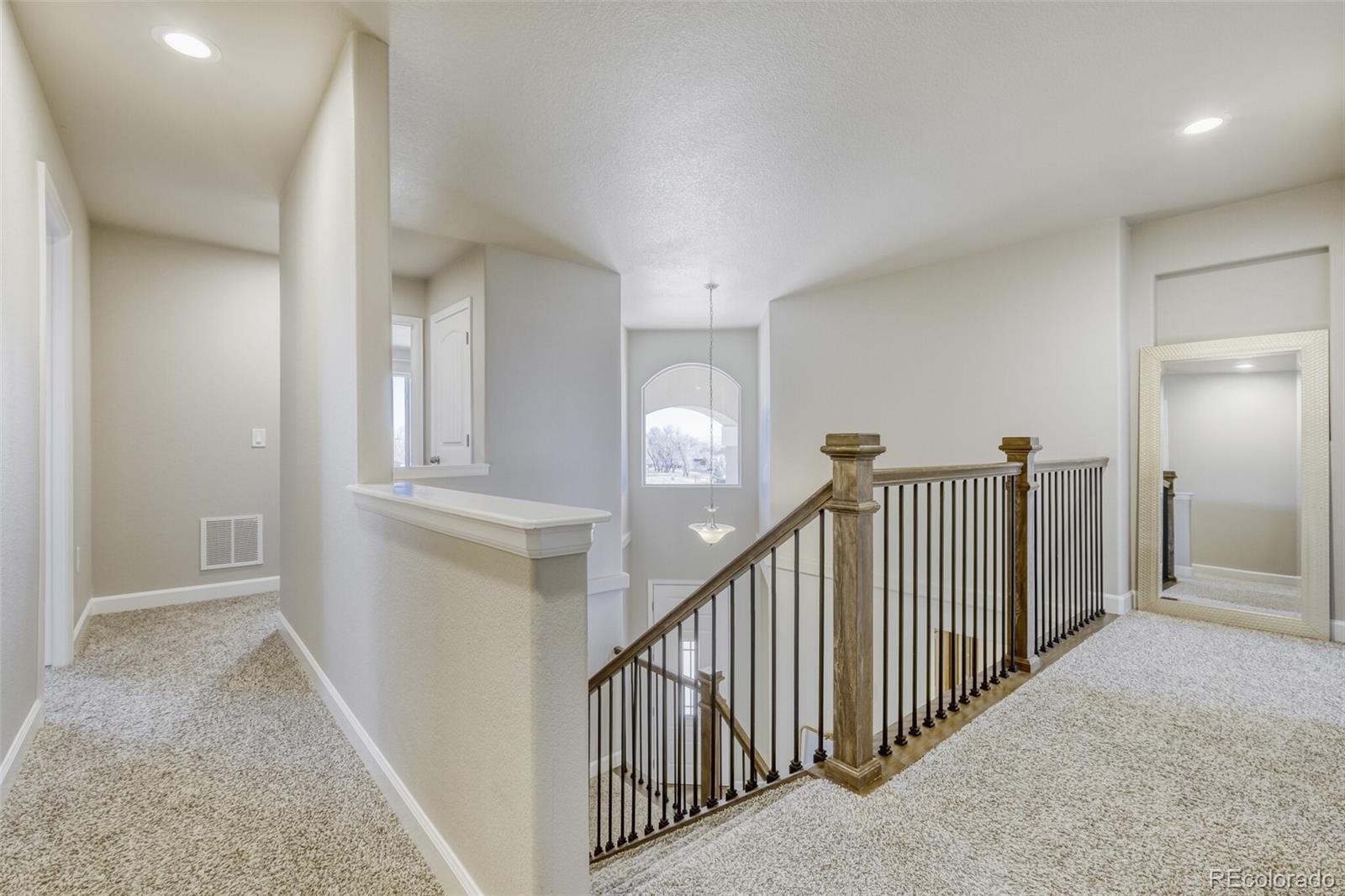 9093 Peaceful Valley Road Colorado Springs, CO 80925 - Photo 16 of 42 en view interior of a house with stairs