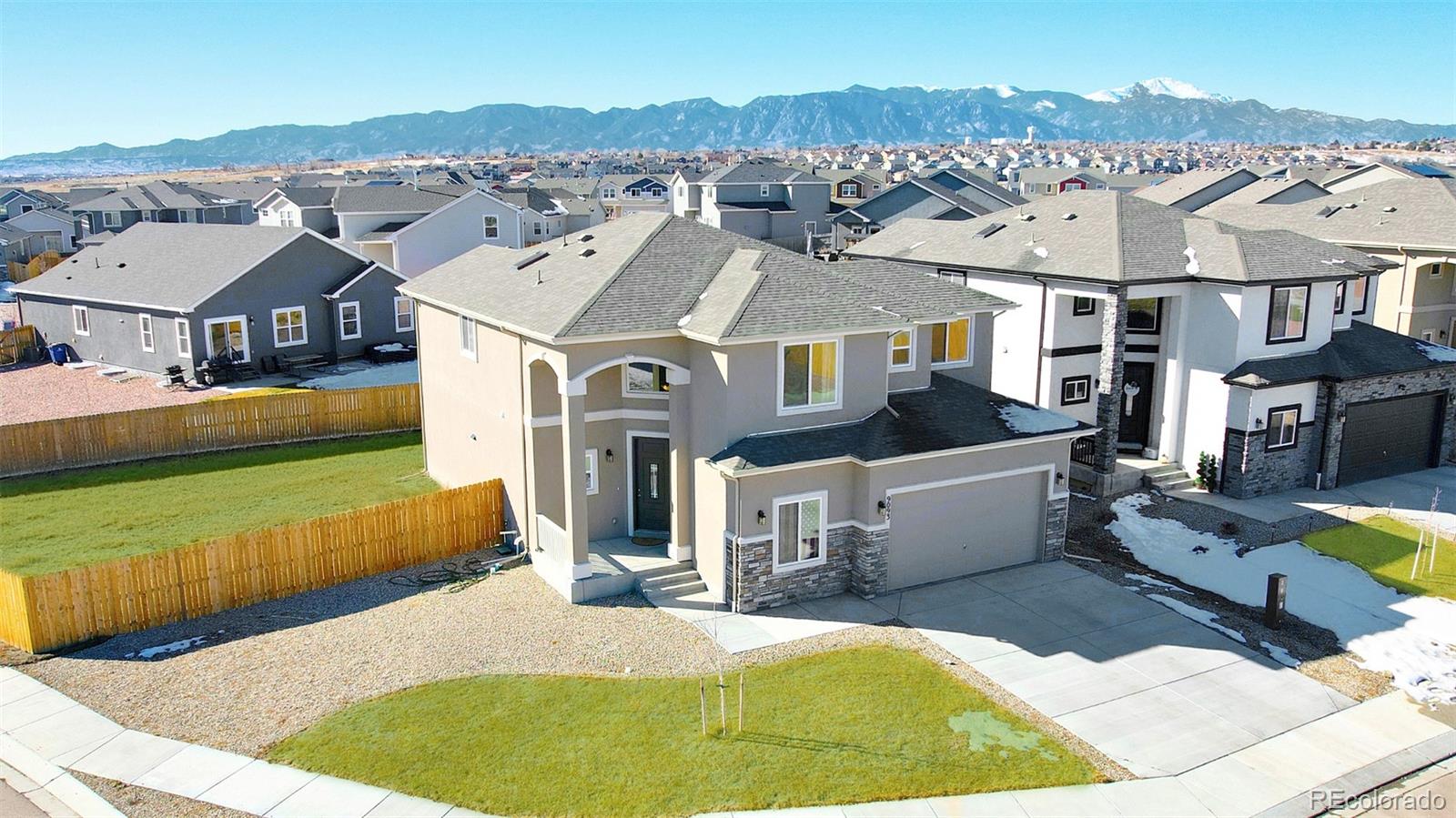 9093 Peaceful Valley Road Colorado Springs, CO 80925 - Photo 2 of 42 a aerial view of a house with swimming pool
