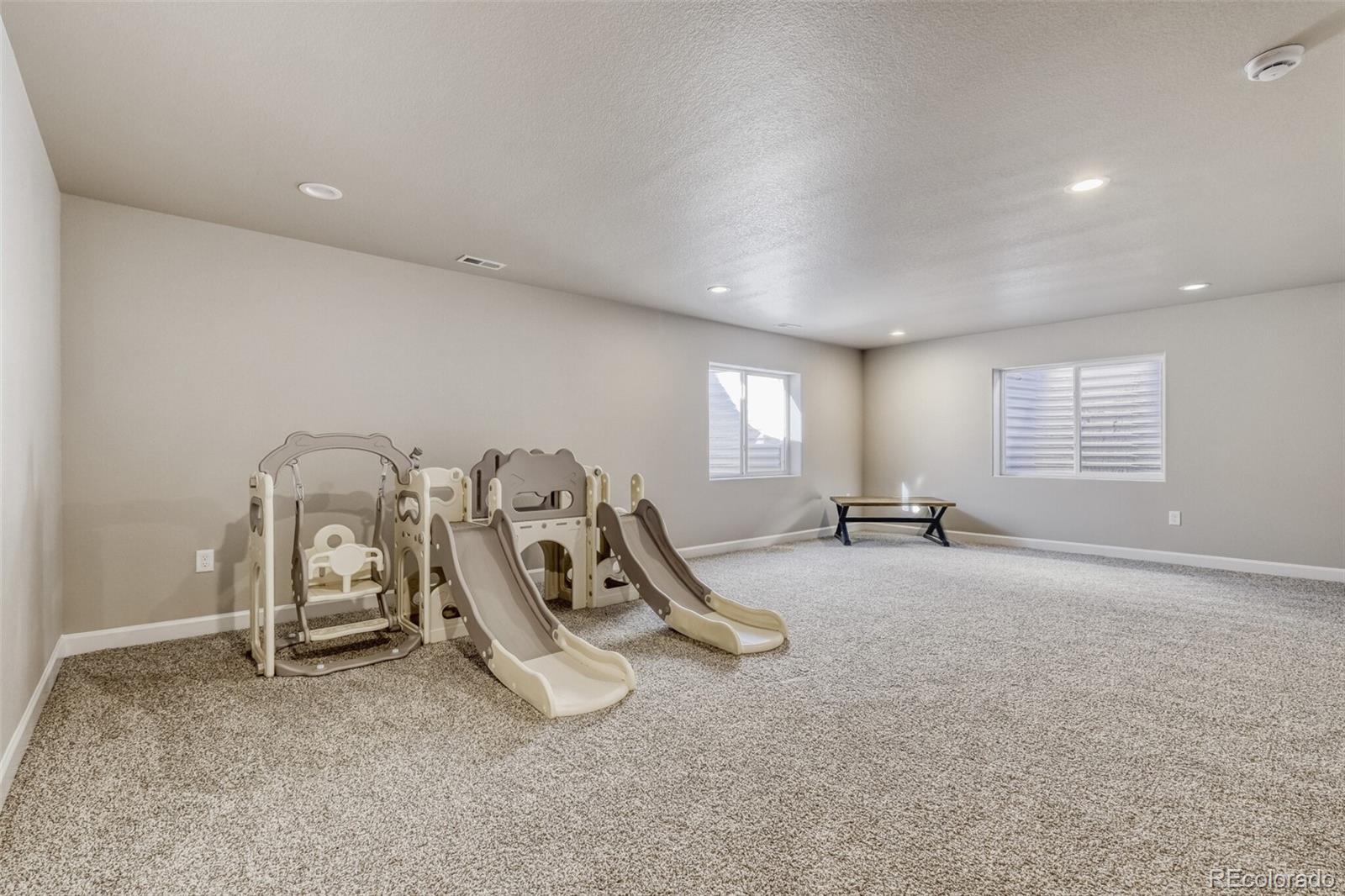 9093 Peaceful Valley Road Colorado Springs, CO 80925 - Photo 32 of 42 a view of a room with gym equipment
